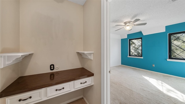 bathroom with a textured ceiling and ceiling fan