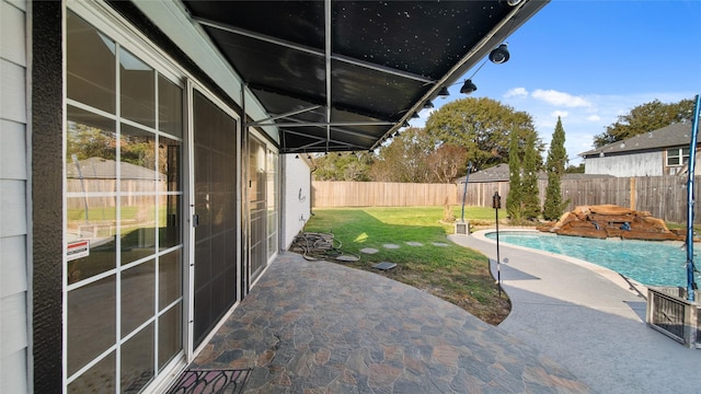 view of patio with a fenced in pool