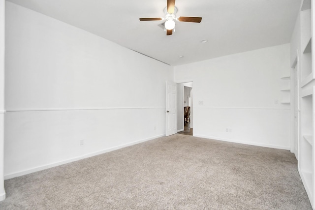 unfurnished room with carpet and ceiling fan