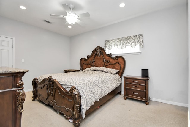 bedroom featuring ceiling fan and light carpet