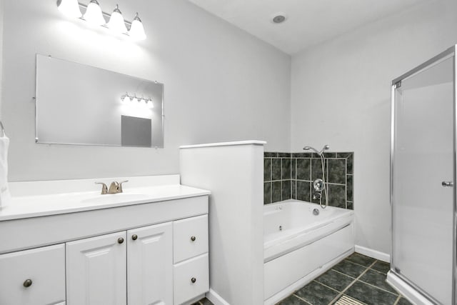 bathroom featuring tile patterned flooring, vanity, and shower with separate bathtub