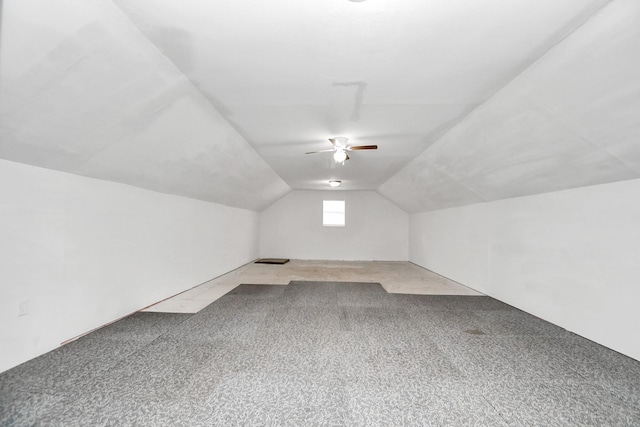 bonus room with ceiling fan, carpet, and vaulted ceiling