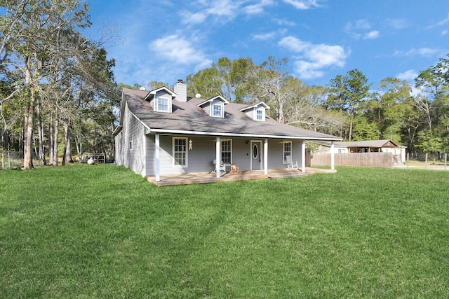 view of front facade with covered porch and a front yard