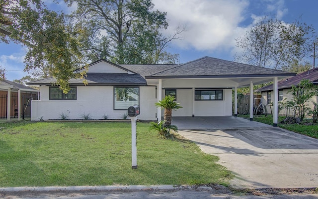 ranch-style home featuring a front yard and a carport