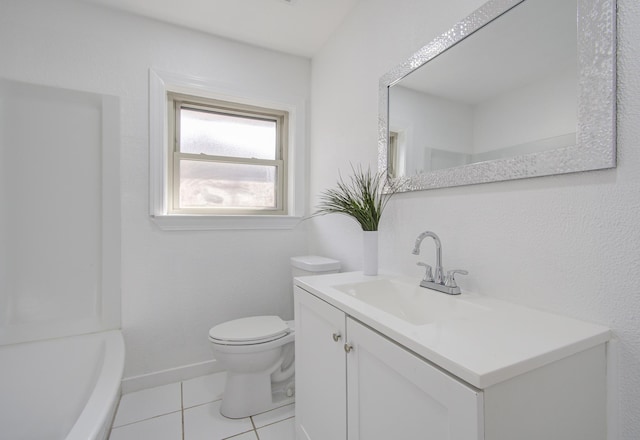 bathroom featuring tile patterned flooring, vanity, and toilet