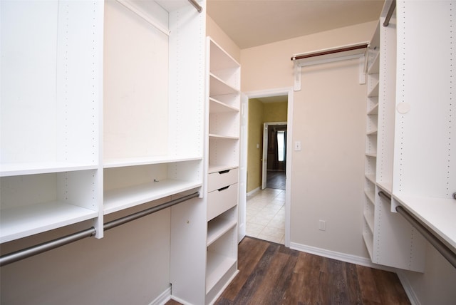 walk in closet featuring dark hardwood / wood-style floors