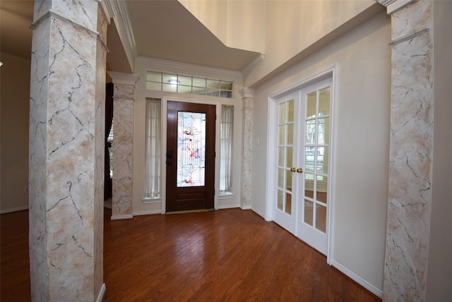 foyer with crown molding, french doors, and hardwood / wood-style floors