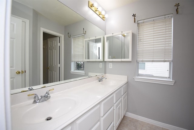 bathroom featuring tile patterned flooring and vanity