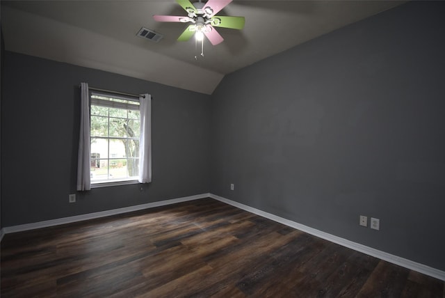 spare room featuring dark hardwood / wood-style floors, ceiling fan, and lofted ceiling