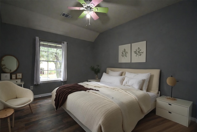 bedroom featuring dark hardwood / wood-style floors, ceiling fan, and lofted ceiling