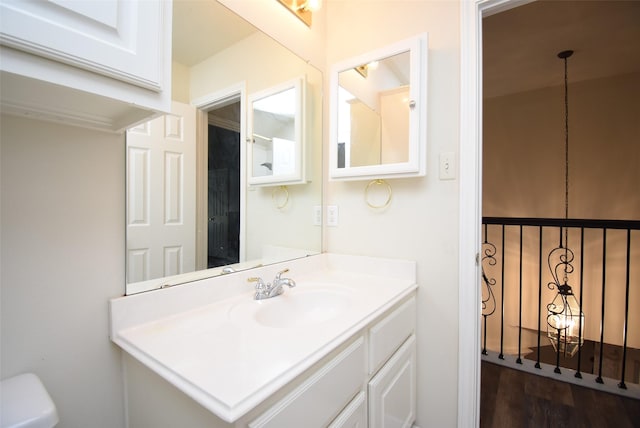 bathroom featuring hardwood / wood-style floors and vanity