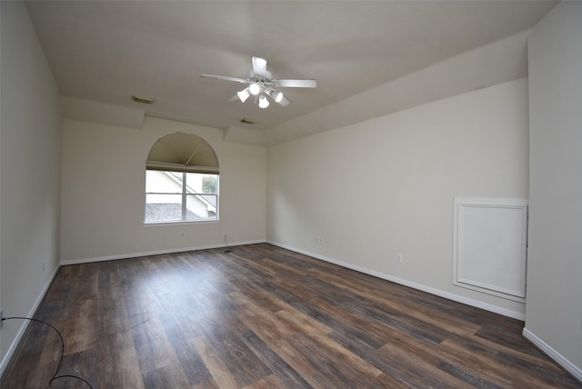 unfurnished room featuring ceiling fan and dark hardwood / wood-style flooring