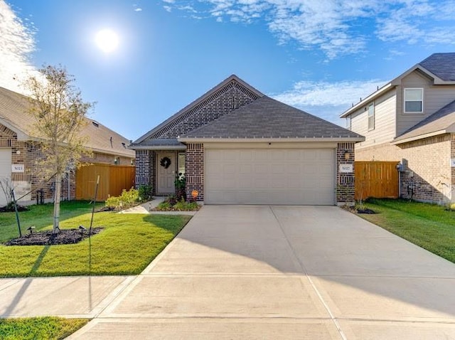 view of front facade featuring a garage and a front yard