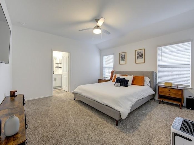 bedroom with lofted ceiling, ensuite bath, ceiling fan, heating unit, and light colored carpet