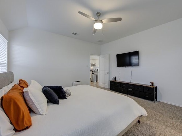 carpeted bedroom with ceiling fan and lofted ceiling