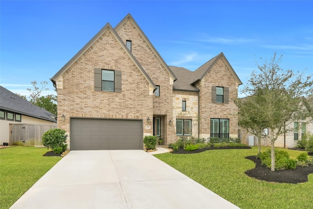 view of front facade with a front yard and a garage