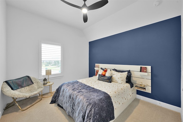 bedroom with light colored carpet and ceiling fan