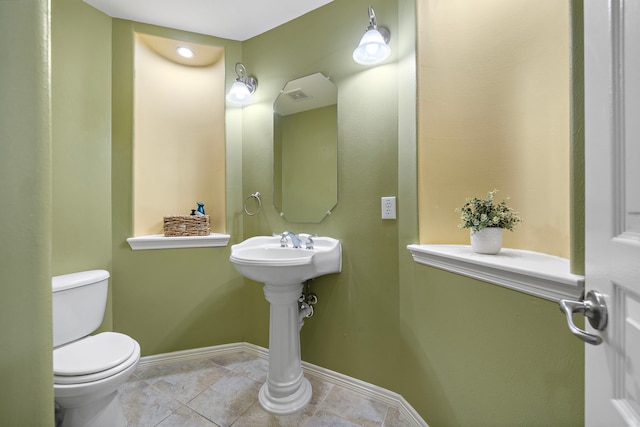 bathroom with tile patterned floors and toilet