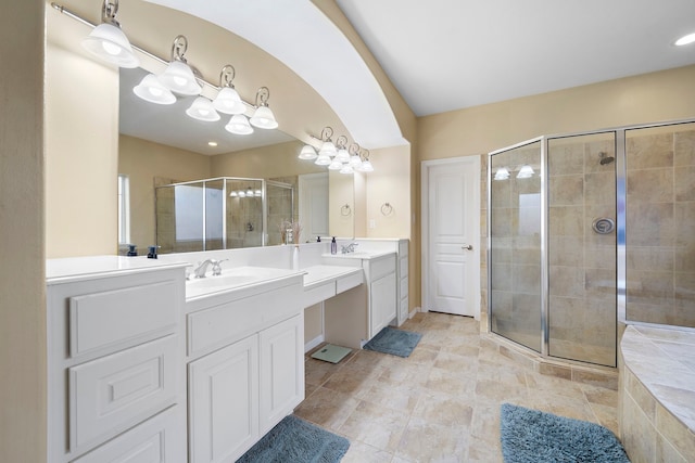 bathroom featuring tile patterned flooring, vanity, and an enclosed shower