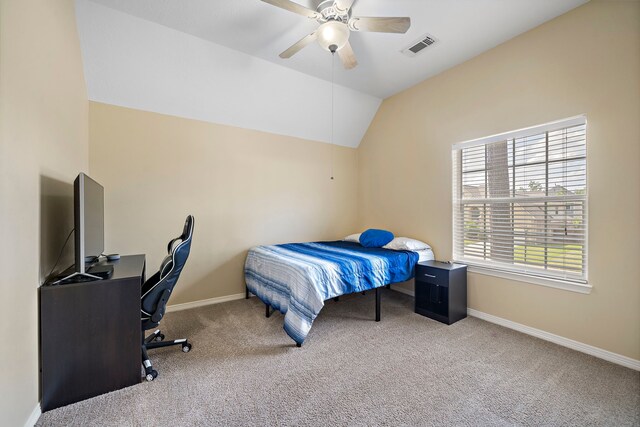 carpeted bedroom featuring ceiling fan and vaulted ceiling