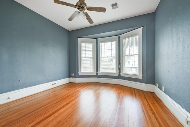 unfurnished room featuring wood-type flooring and ceiling fan