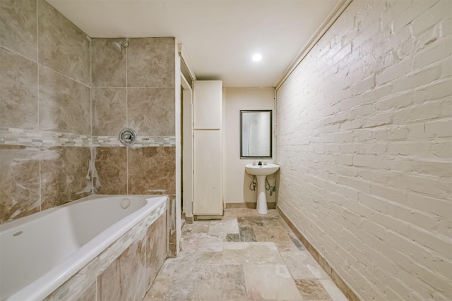 bathroom with brick wall