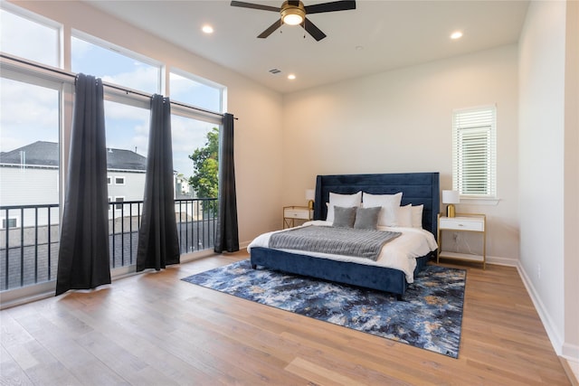 bedroom featuring light wood-type flooring, access to outside, and ceiling fan