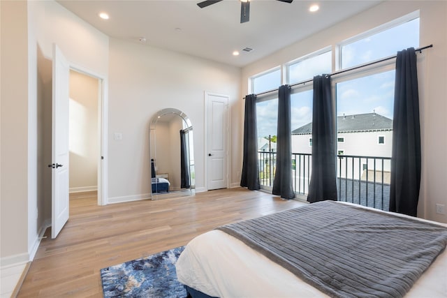 bedroom with access to outside, ceiling fan, and light wood-type flooring