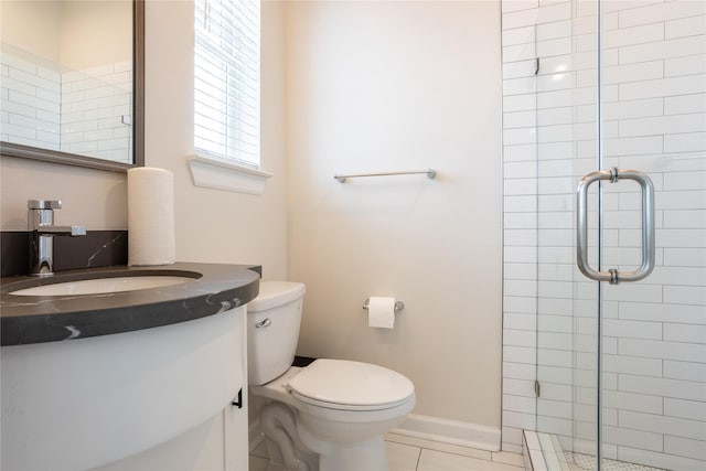 bathroom with toilet, vanity, tile patterned floors, and a shower with door