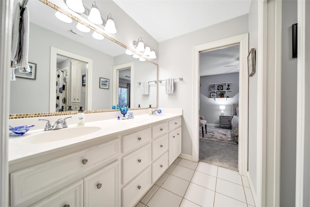 bathroom featuring tile patterned flooring, vanity, and ceiling fan