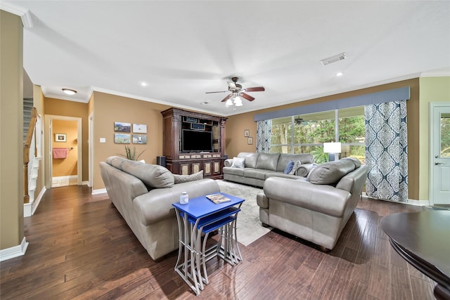 living room featuring ceiling fan, crown molding, and dark wood-type flooring