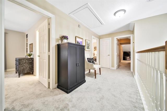 corridor with light colored carpet