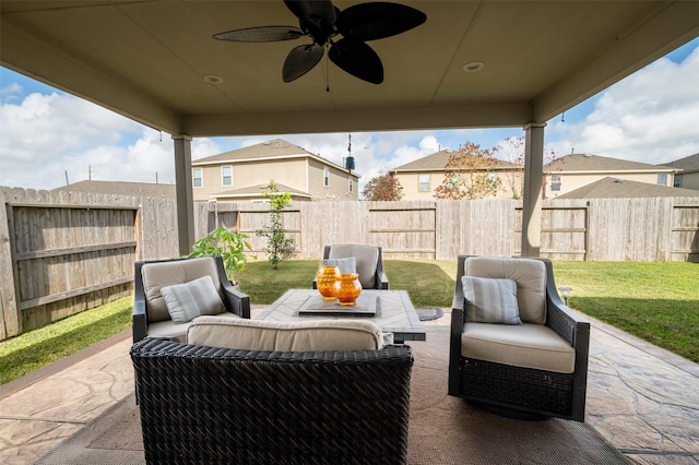 view of patio / terrace with ceiling fan and an outdoor living space