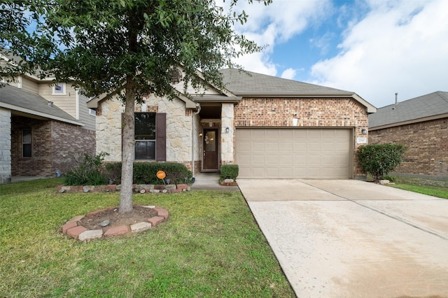 view of front of house with a front yard and a garage