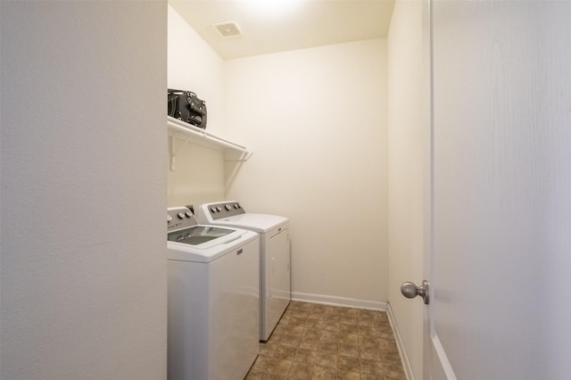 laundry room featuring independent washer and dryer