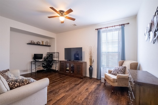 living room with ceiling fan and dark hardwood / wood-style flooring