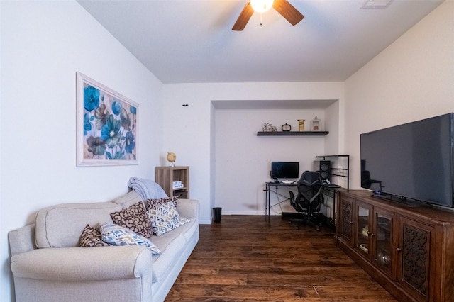 living room with ceiling fan and dark hardwood / wood-style flooring