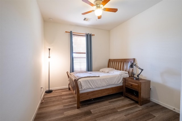 bedroom with dark wood-type flooring and ceiling fan