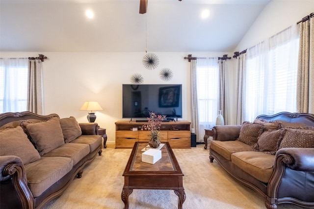 carpeted living room with lofted ceiling and ceiling fan