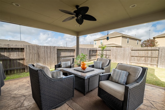 view of patio / terrace with an outdoor living space and ceiling fan