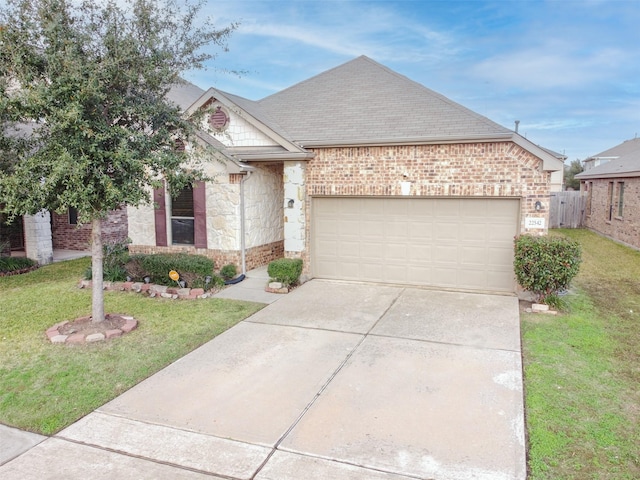 view of front facade with a garage and a front yard