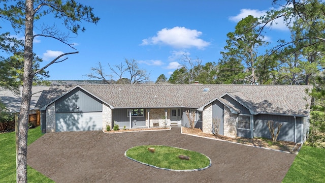 single story home featuring a garage