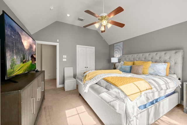 carpeted bedroom featuring ceiling fan, lofted ceiling, and a closet