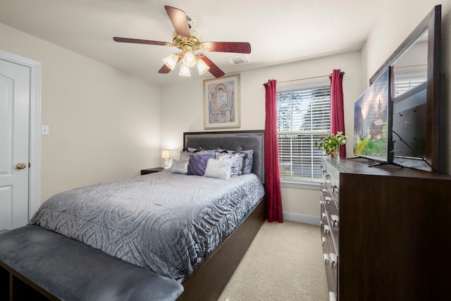 bedroom featuring ceiling fan and light colored carpet