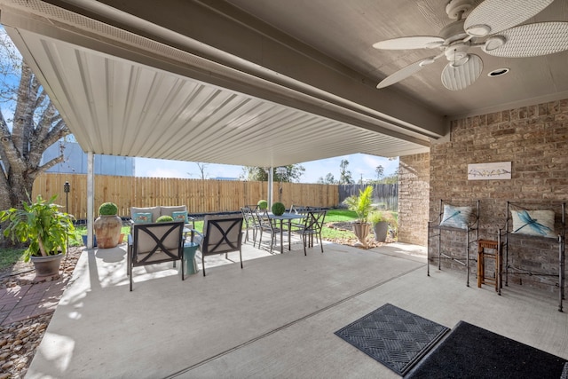 view of patio with ceiling fan and an outdoor living space