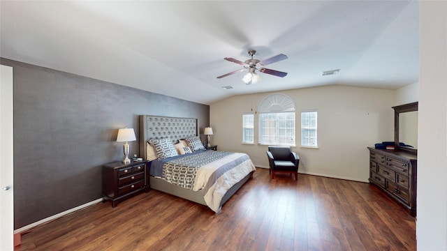 bedroom with vaulted ceiling, ceiling fan, and dark hardwood / wood-style floors