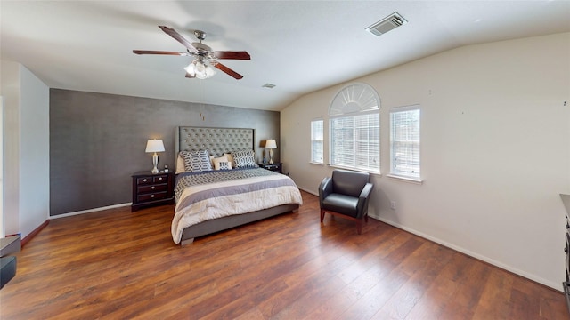 bedroom with vaulted ceiling, ceiling fan, and dark hardwood / wood-style floors