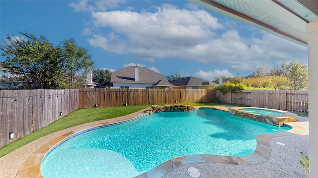 view of pool with an in ground hot tub