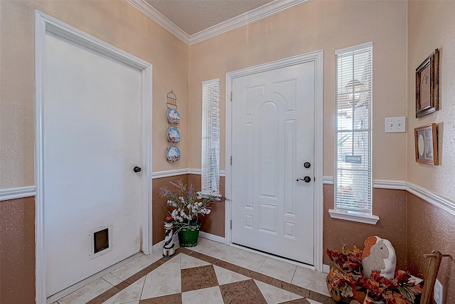 tiled entrance foyer with crown molding