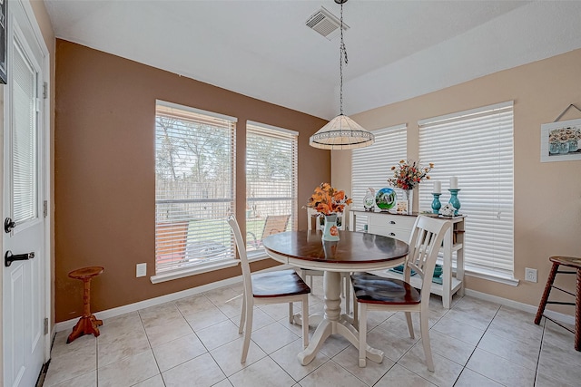 dining space with light tile patterned floors